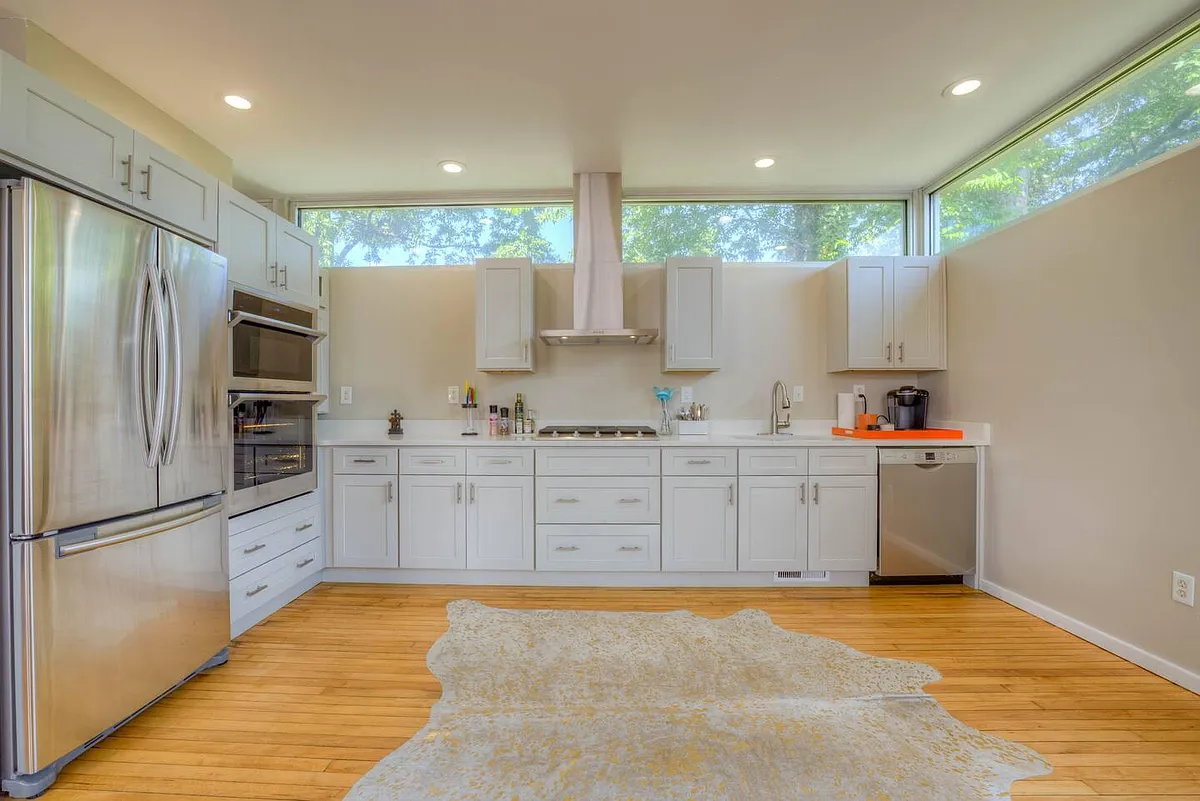 Recently renovated kitchen with gas range, outside venting hood, dishwasher, double oven and french door refrigerator - 41 Diana St