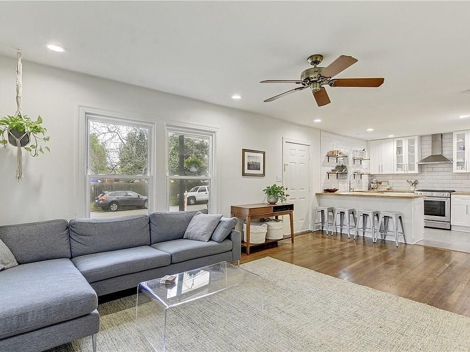 Bright and Spacious Open Concept Living Room to Kitchen - hardwood floors throughout! Updated Kitchen with New Appliances!
