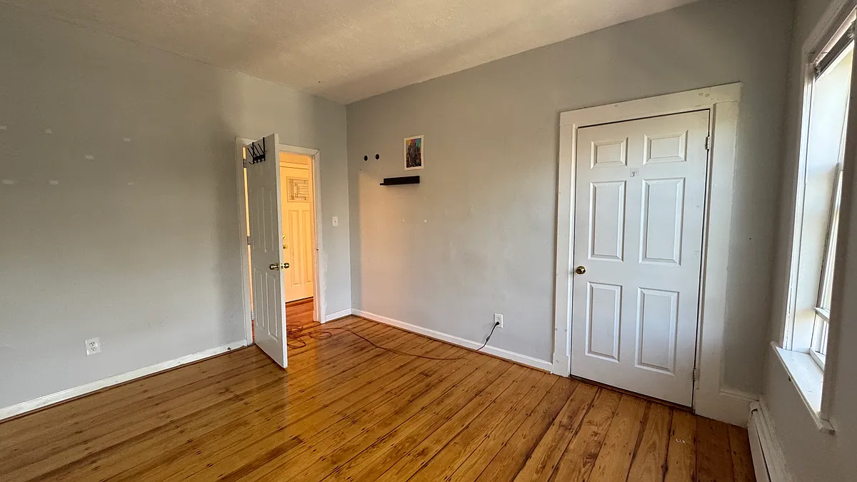 second bedroom looking towards closet and out to hallway - 212 Boylston St #3