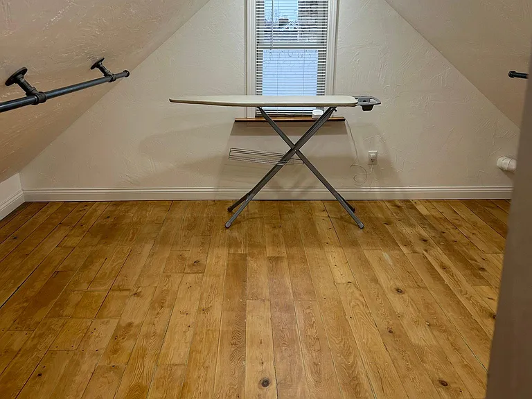 Large closet area with iron and ironing board