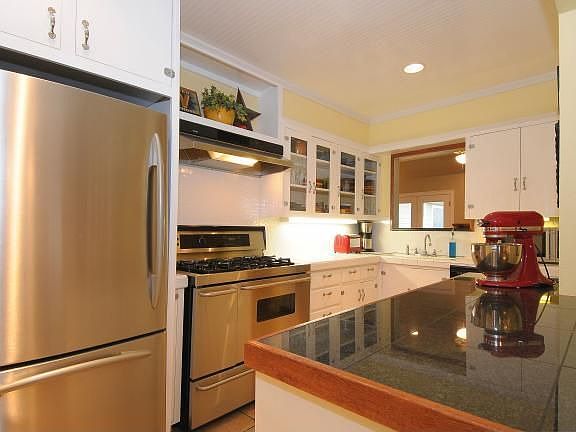 You will love the custom cabinets and stainless appliances/ 5 burner stove