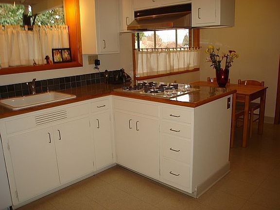 Modern kitchen with gas, separate eating nook with view of private back yard