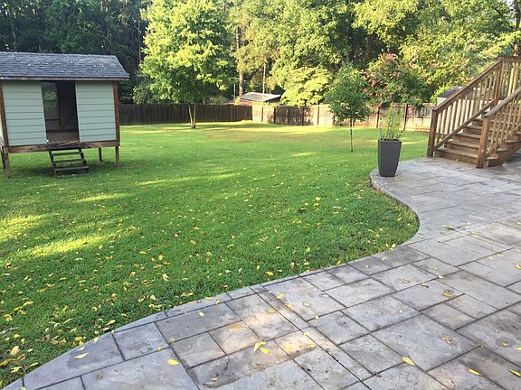 great back yard with patio