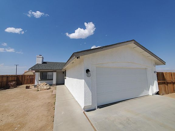 Fresh whisper white paint exterior with open country setting.