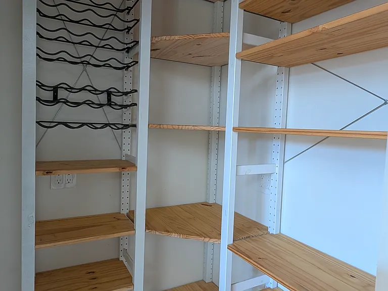 "Working" pantry has plugs near shelves, so you can leave your toaster oven, mixer and waffle maker in the pantry without needing to take it out for every use.