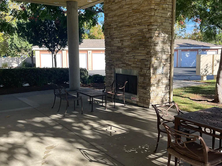 Clubhouse Outdoor entertainment area with fireplace