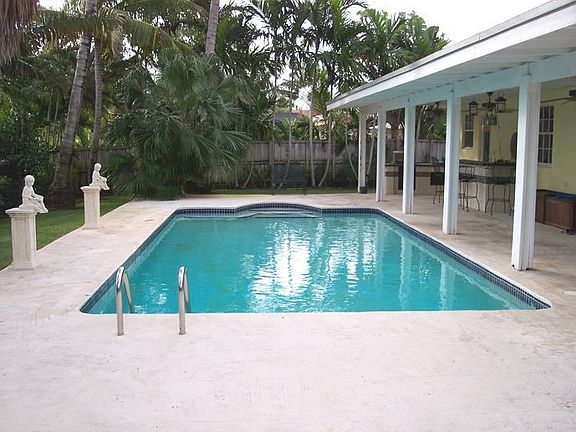 large pool area with built in bar and grill