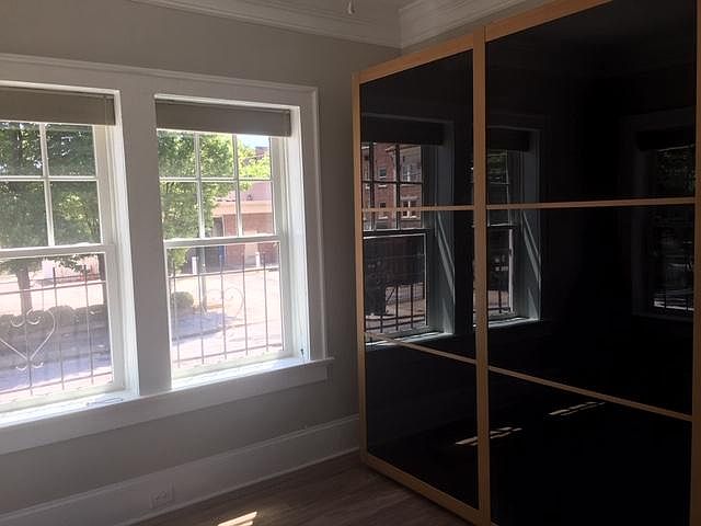 Bedroom with full wall closet