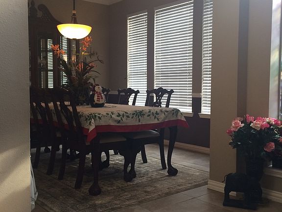 Formal dining with tile floo