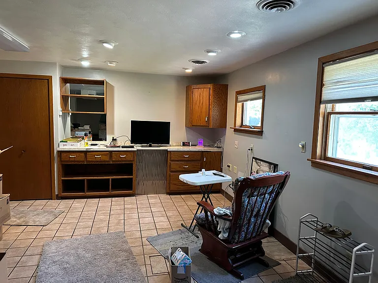very large room to enter could place tv on far wall bright to west living space with closet with shelves on the one side. and closet you can't see on onther side also.
