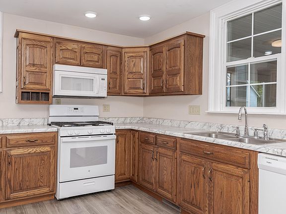Beautiful country kitchen with pantry and plenty of cabinet space.