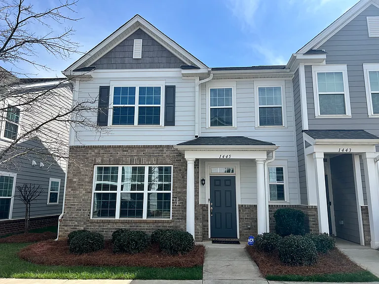 Two story furnished townhouse with first floor primary bedroom
