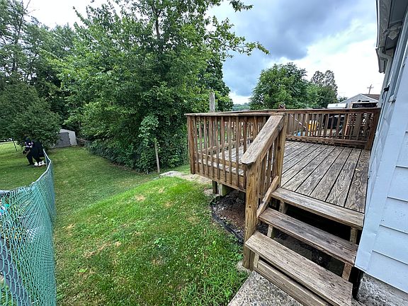 Rear deck, yard and storage shed off of kitchen