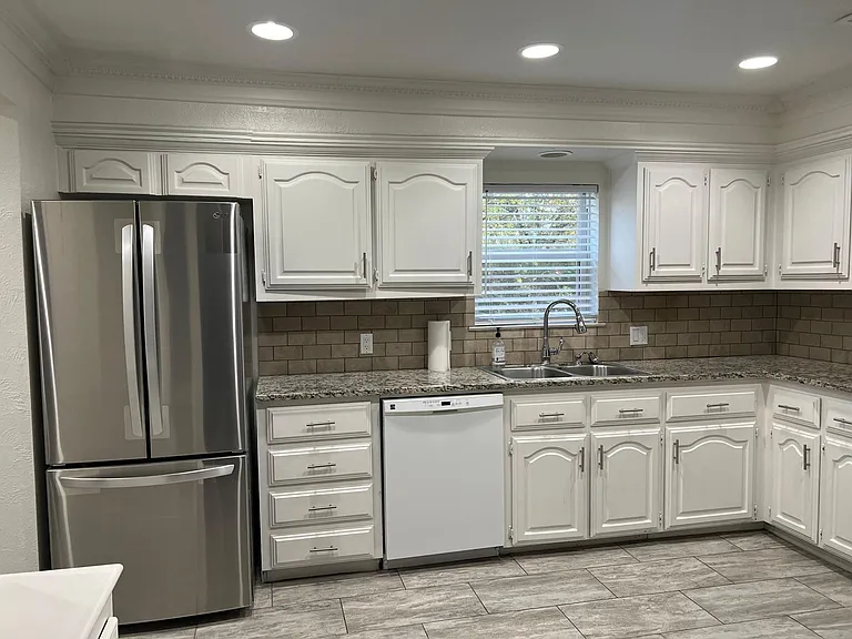Tons of kitchen storage, open area great for cooking, plus NEW Fridge with icemaker!