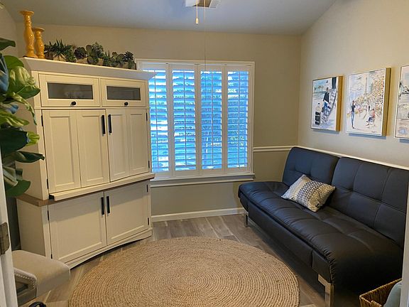 This is the fourth bedroom or office space. The futon is it full size, the credenza pulls out with a full monitor, keyboard, mouse along with other office amenities.