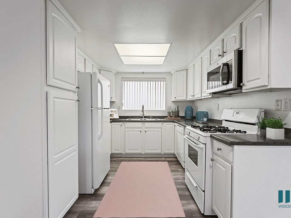 Full-Size Kitchen with Refrigerator, Stove, Dishwasher, and Microwave Oven