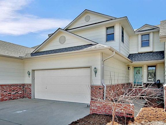 Double car garage with opener and key pad.