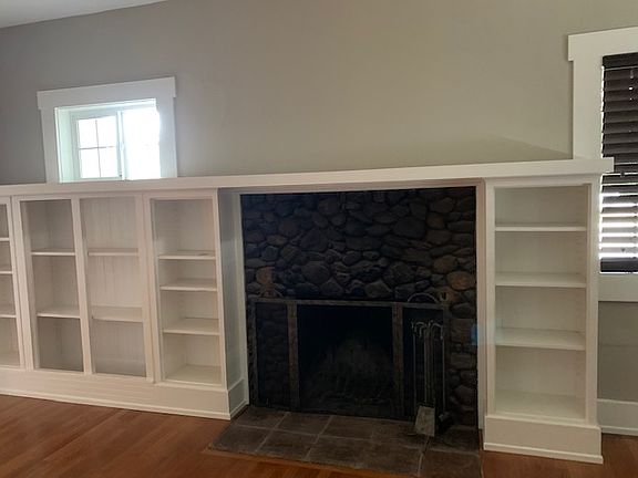 Living room fireplace and shelving
