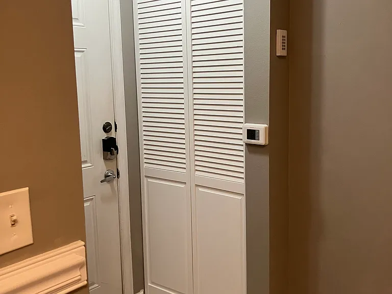 A/C closet with one year old unit.