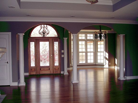 Formal entry way columns divide entry way and formal dining room