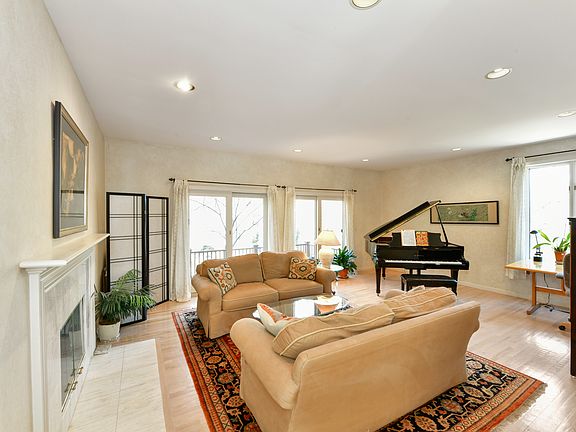 Formal Living Room With Marble Fireplace
