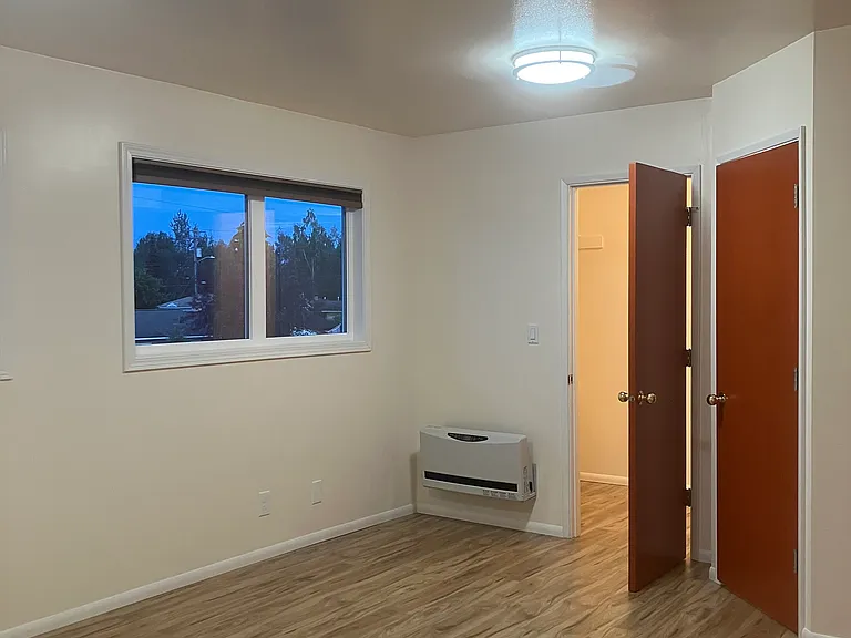 Spacious upstairs bedroom with mountain views.