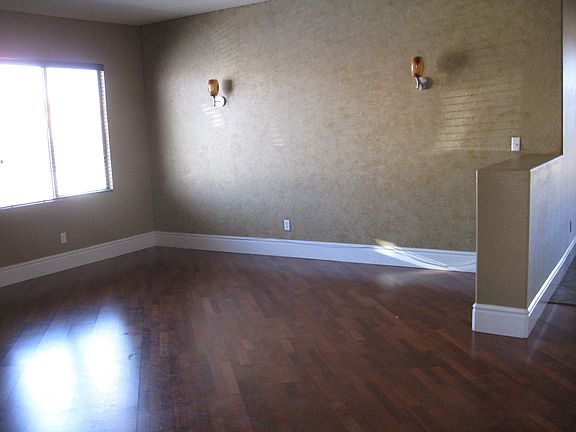 Living room-Wood flooring, custom paint with accent wall & elegant lighting