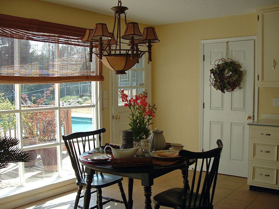 Sunny kitchen with view of pool