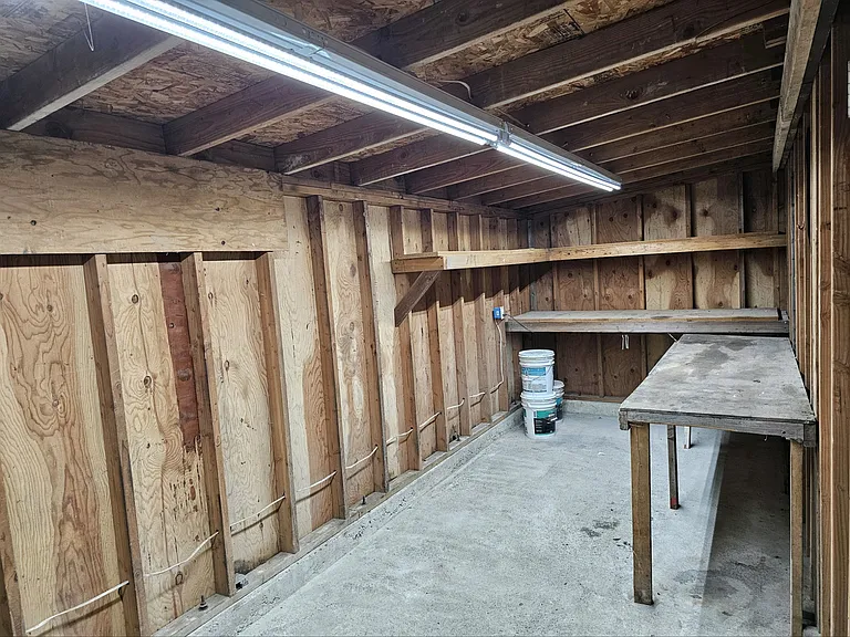 Inside the shop area, with carport entrance