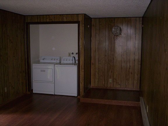 I painted and replaced damaged paneling, room is now white.