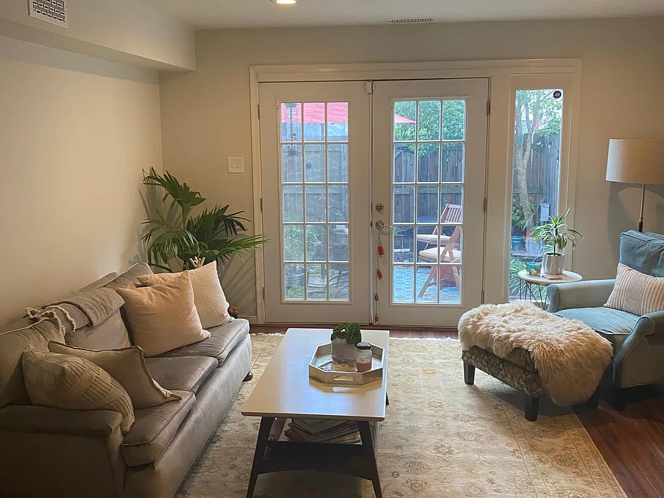 Living room with French doors and a screen to enjoy the breeze!