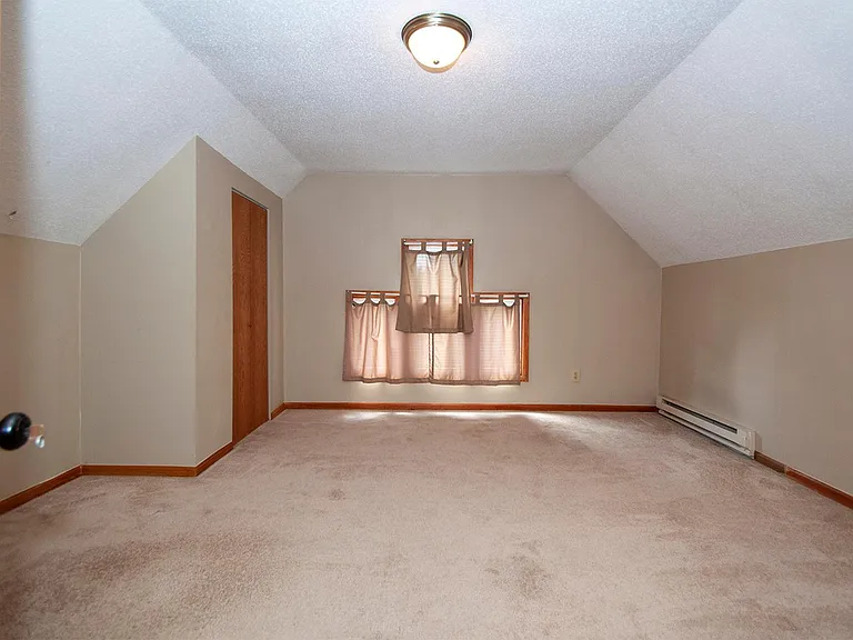 There is new carpet in this bedroom.