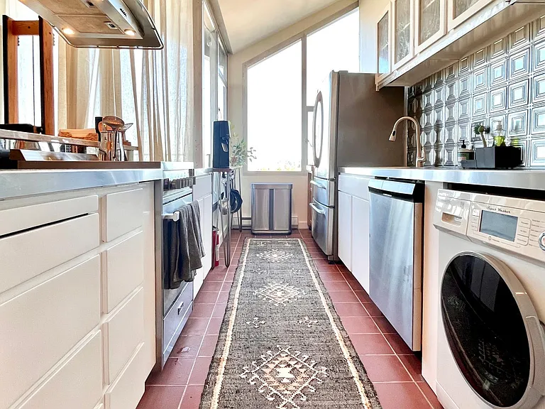 View of kitchen and washing machine