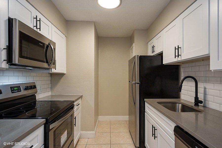 Newly renovated kitchens with subway tile backsplash and all new stainless steel appliances