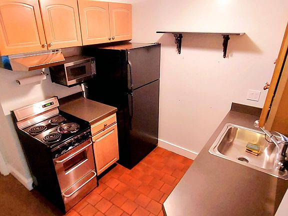 Kitchen with electric stove and DW (out of view below)