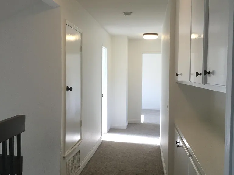 hallway from master bedroom to 3 bedrooms at end of hallway
