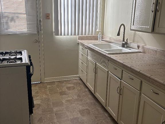 Kitchen with stove as back door area