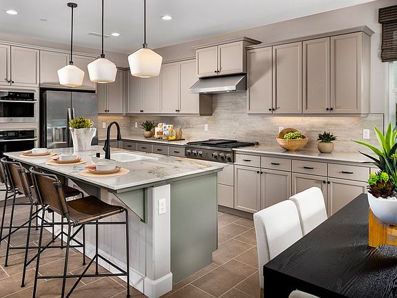 The Kitchen features designer finishes along with stainless-steel appliances and extensive cabinetry
