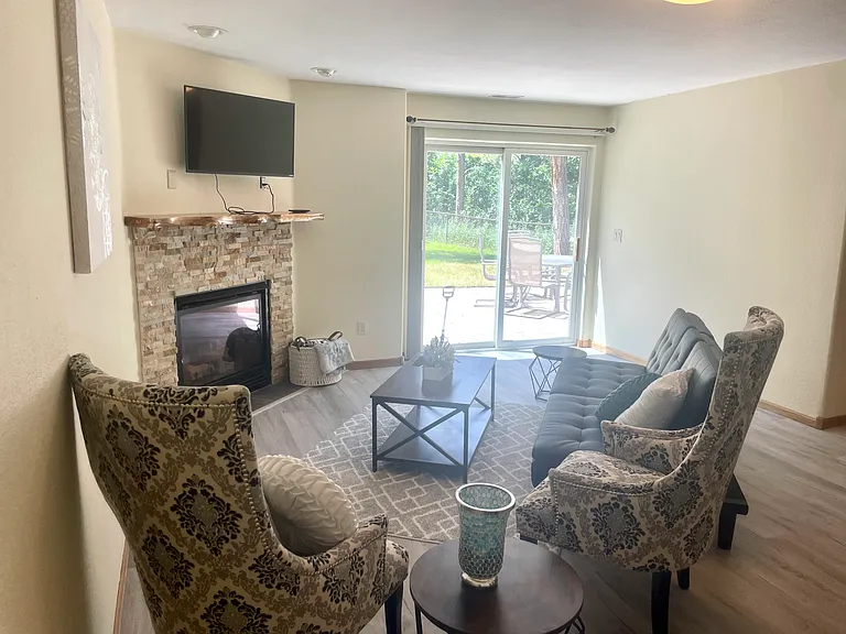 Lower level family room area (futon) . Walk-out to backyard.