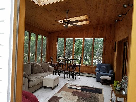 Elegant sunroom leading to private patio area