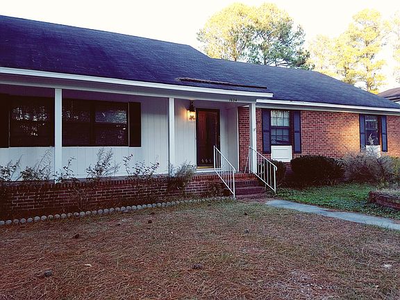 Solid home, large yards!