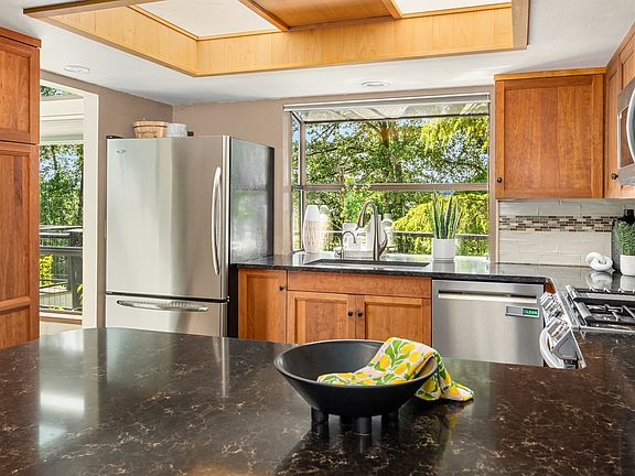 Kitchen with new appliances including gas range