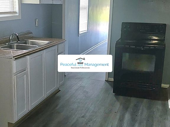 Kitchen with stove and refrigerator