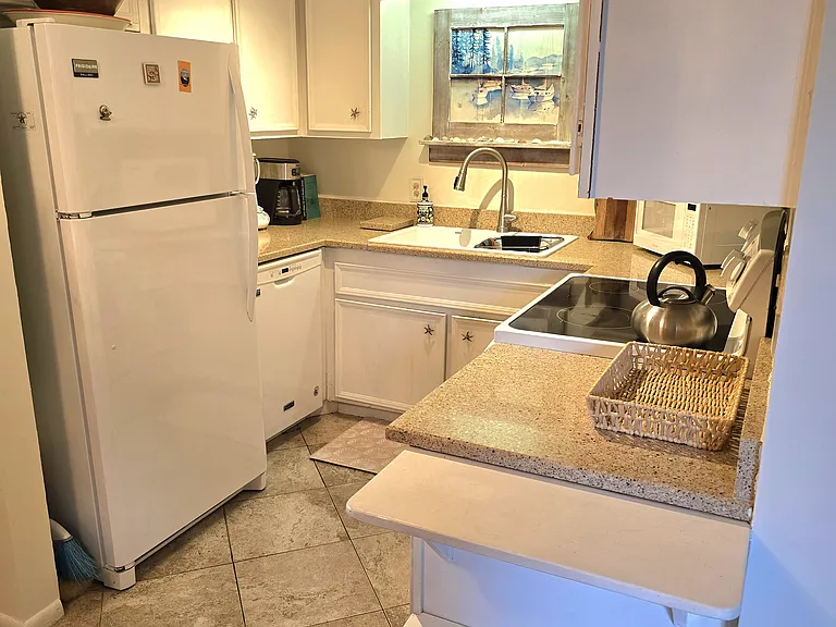 Kitchen, fully equipped including a stew pot, casserole dishes, measuring utensils, mixing bowls, etc.