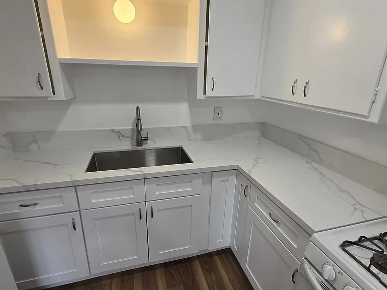 Brand new stone countertops, sink, lower cabinets