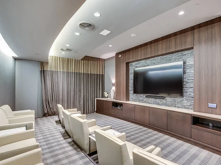Screening room with HDTV, surround-sound and club chair seating