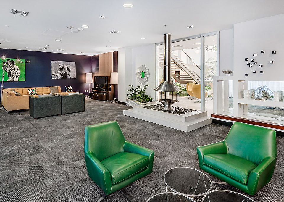 Club room with sofa and lounge chairs.