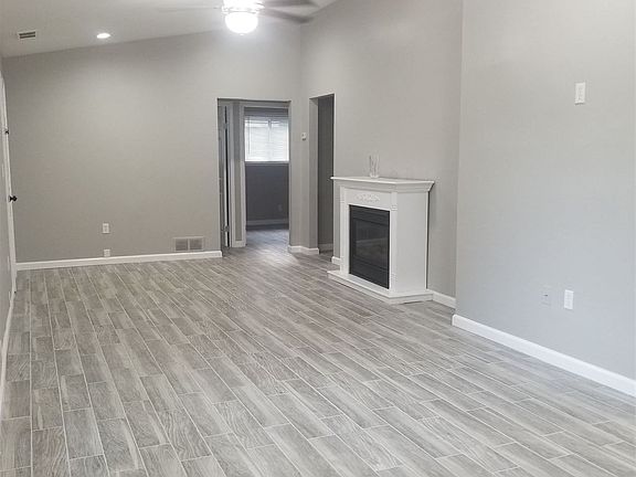 Dining room into living room with vaulted ceilings