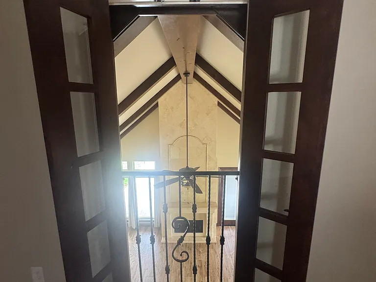 Balcony window from tv/game overlooking family room