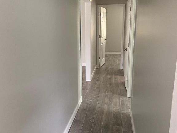 Hallway with 3 bedrooms and bath